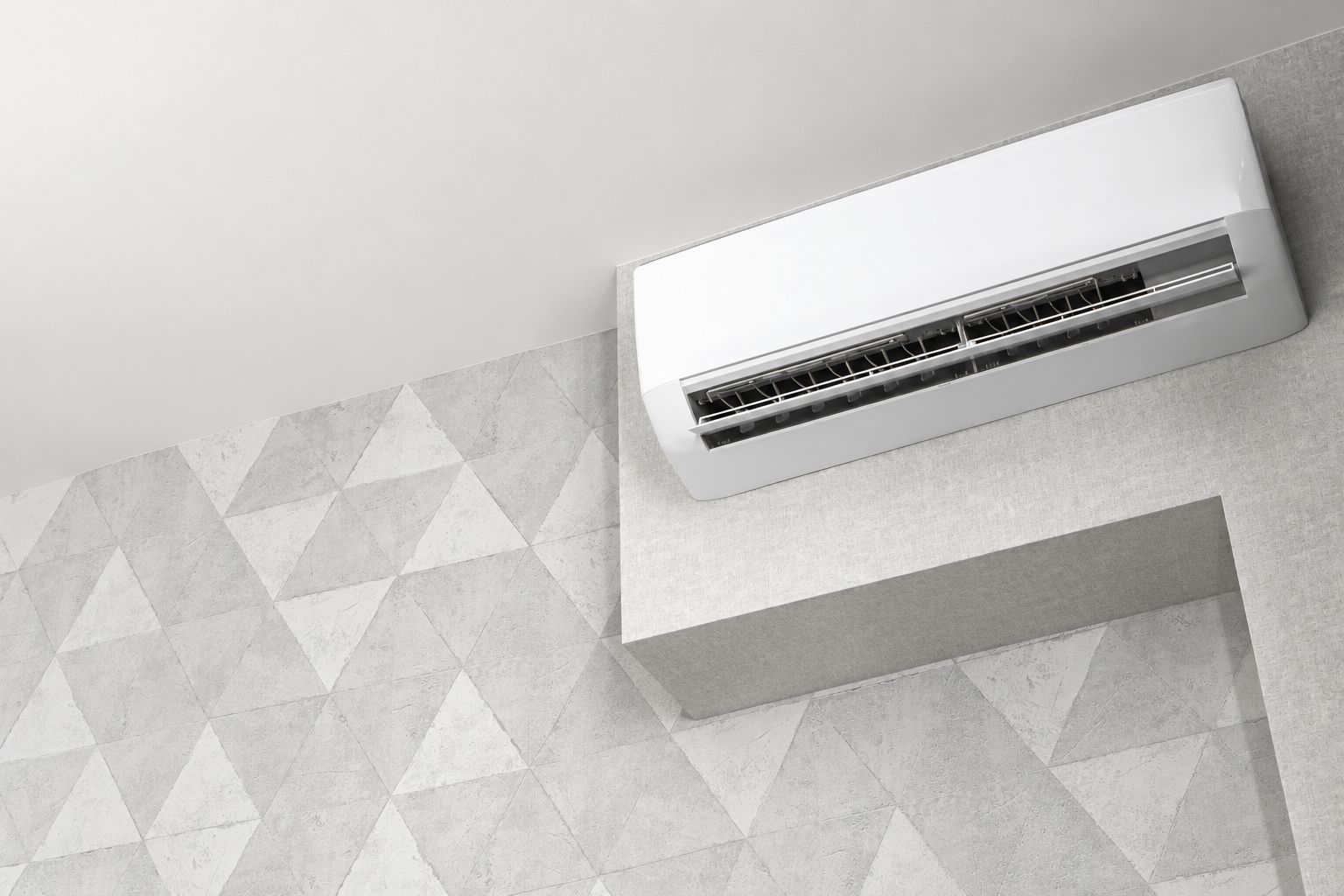 Illustrative wall-mounted air-conditioning unit in a pale grey interior