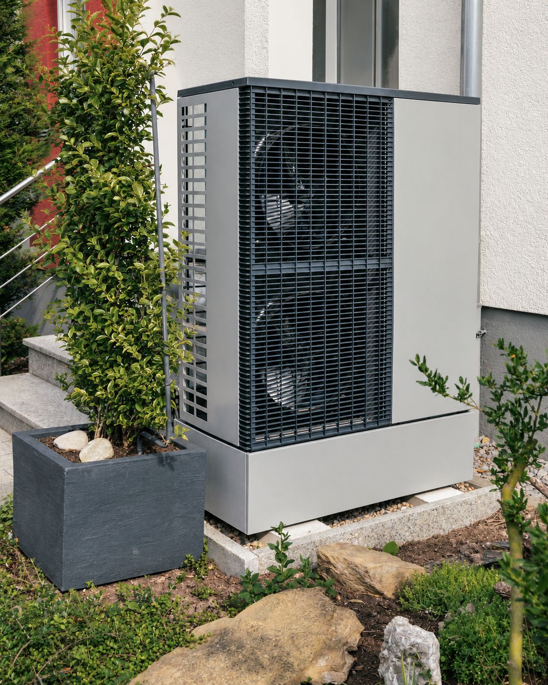 Illustrative outdoor heat-pump unit beside a house